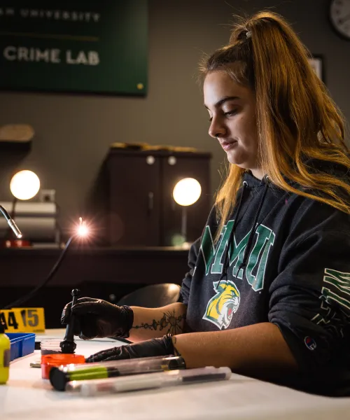 NMU Student processing cold case evidence